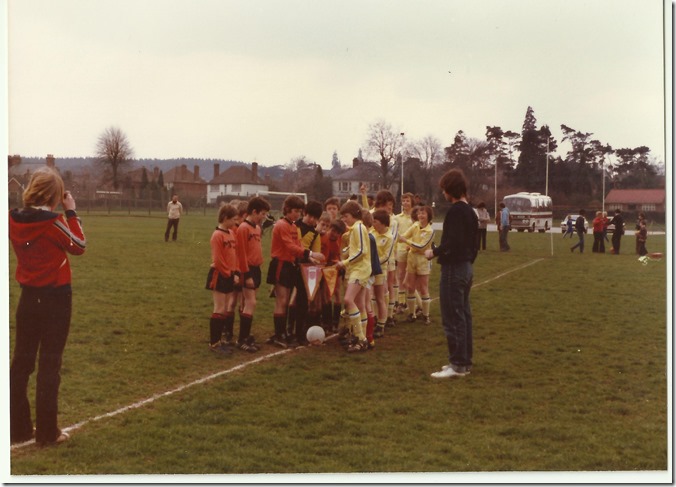 Late 70's at Fulbrook Middle School. Lions in yellow exchanging pennants with a team from Belgium.